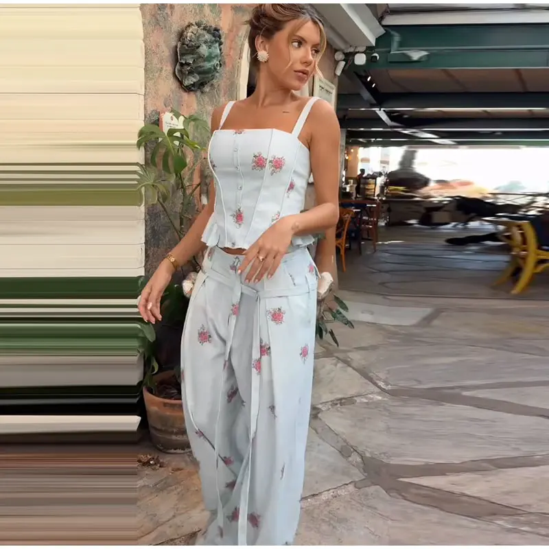 Three-quarter view of floral top and pants outfit