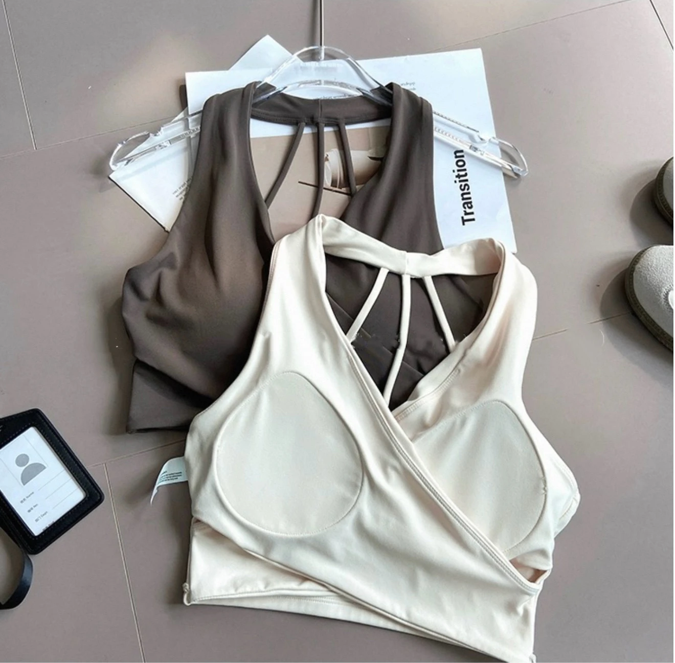 Back and inner view of white and dark gray sports bras