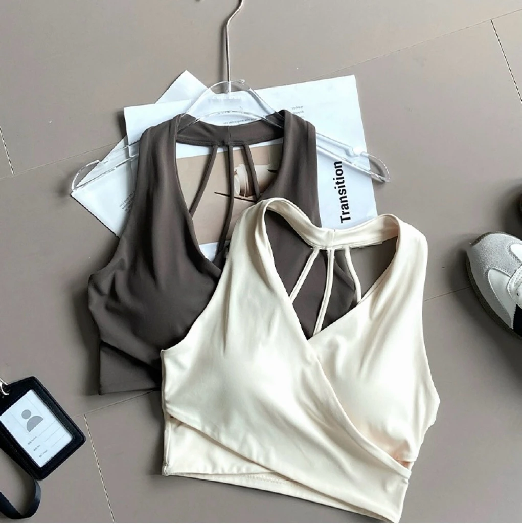 White and dark gray wrap-front sports bras